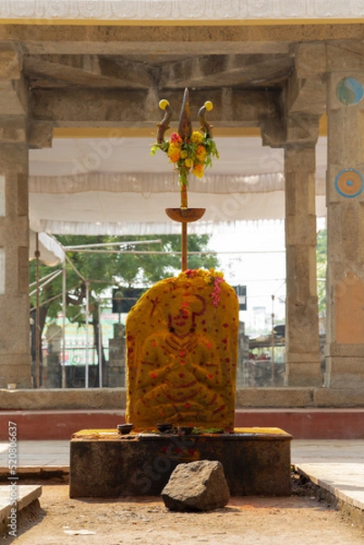 Fototapeta Carved Rock of a Hindu goddess temple with weapon Trishool