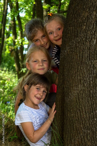Fototapeta Group of little girls have a nice time together