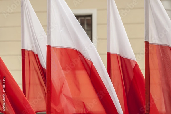 Obraz Polish flags on a background of wall.