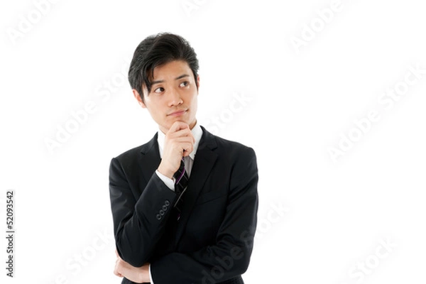 Fototapeta あごに手をあてて考える若いビジネスマン