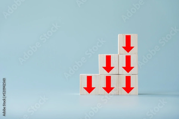 Fototapeta Business decline, performance decrease arrow drop down. Market loss concept diagram in  arrow chart wooden block.