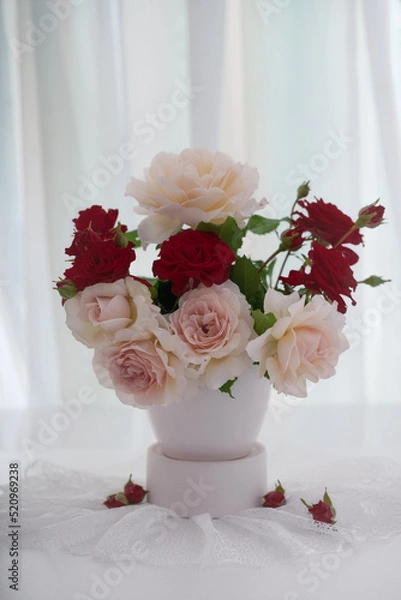 Obraz Bouquet of red and white roses on a light background