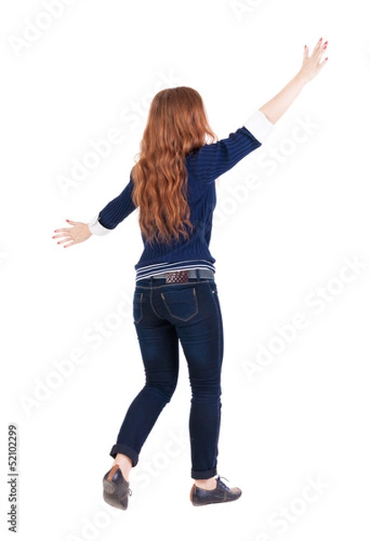 Obraz back view of walking  woman