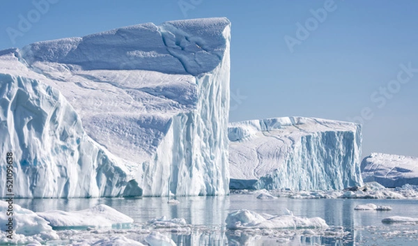 Fototapeta Towering great icebergs in the Ilulissat Icefjord in Greenland