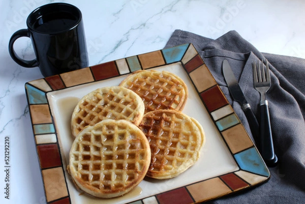 Obraz Waffles, with butter and syrup, and coffee make a nice brunch
