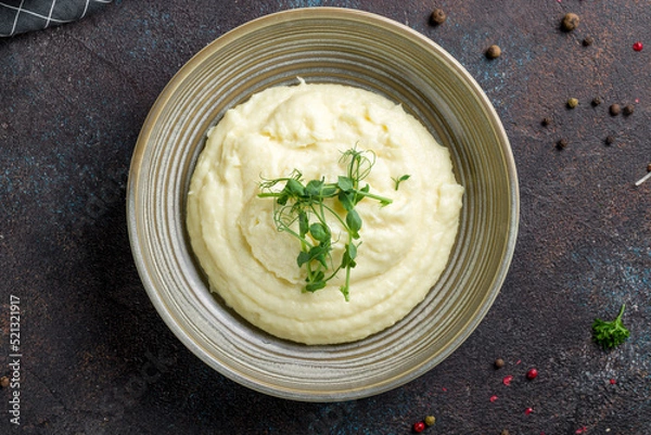 Obraz mashed potatoes on bowl on dark stone table top view