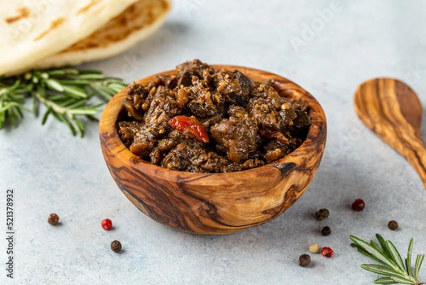 Fototapeta Greek dips and spreads. Traditional classic menu and cuisine items. Hummus, Tzatziki, Olive Tapenade made with fresh ingredients such as lemon juice and olive oil served with hot homemade pita bread