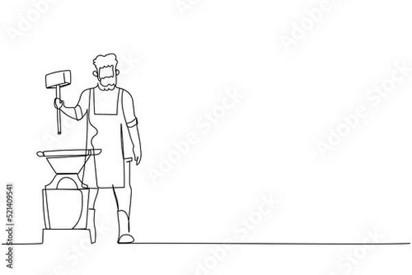 Fototapeta Single continuous line drawing bearded blacksmith wearing apron standing and holding hammer in front of the anvil. Craftsman working with iron at workshop. One line graphic design vector illustration