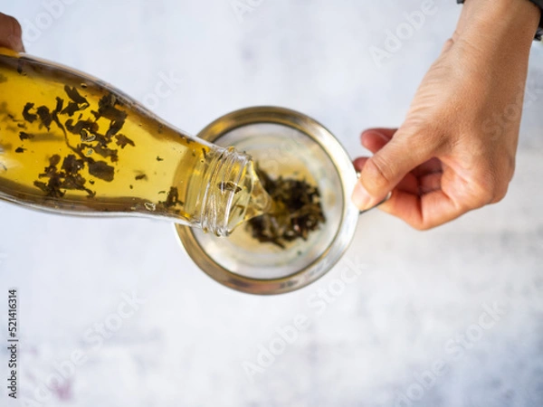 Fototapeta Watching from above as a green tea filters down