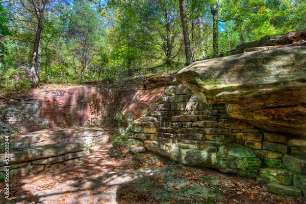 Obraz Old stone work on a forest hillside