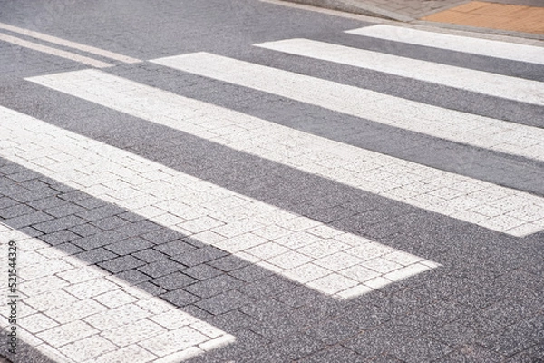 Fototapeta View on pedestrian crossing in city. Road regulations