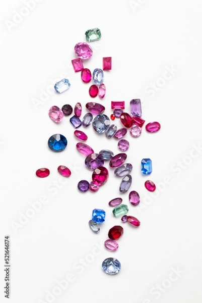 Fototapeta Synthetic Stones for jewellery making. Faceted colorful glass rhinestones on White
