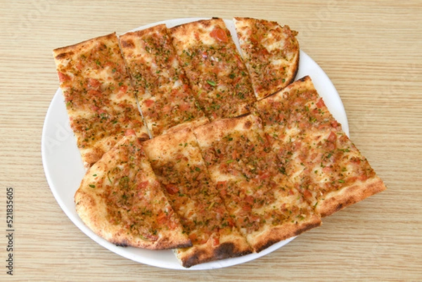 Fototapeta Kiymali pide. Turkish pide with minced meat. Turkish pizza mince pita Pide on white background. Etli ekmek. Kusbasi kasarli pide.