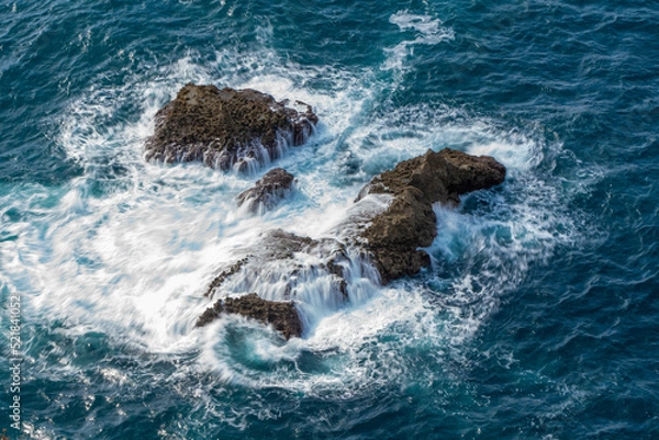 Fototapeta ocean rocks with foam