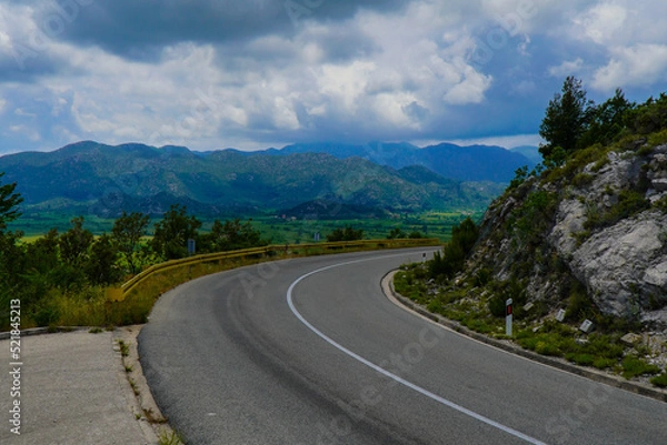 Fototapeta Turning a road in the mountains with a view of the beautiful mountains of southern Croatia