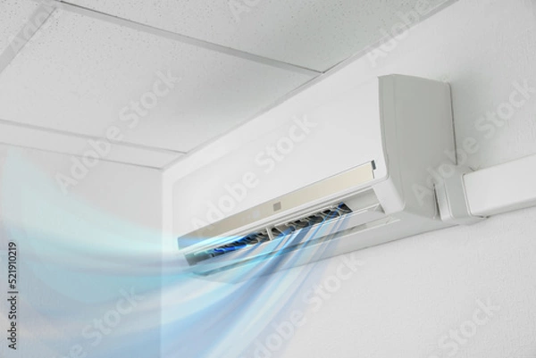 Fototapeta Modern conditioner and illustration of cool air flow on white wall indoors