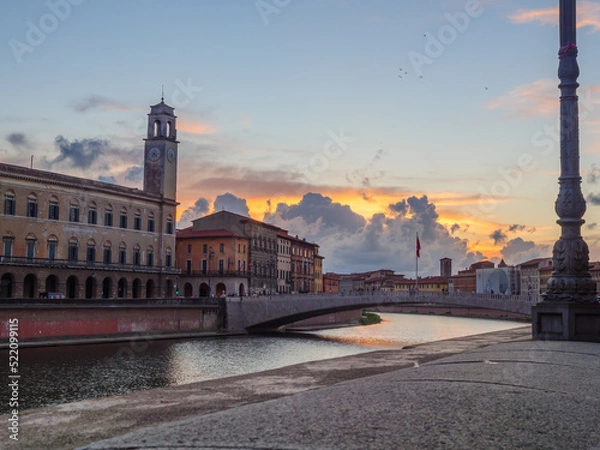 Fototapeta View of the Arno at sunset from the city of Pisa