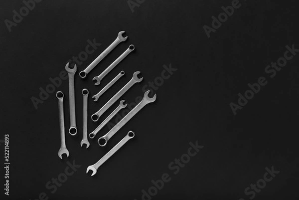 Fototapeta Adjustable wrench on black background