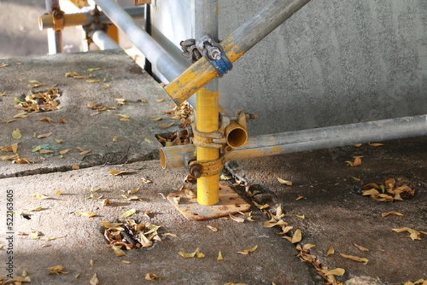 Fototapeta Scaffolding pipe clamp. Steel scaffolding and mounting parts for strength in construction sites . Close-up and select focus