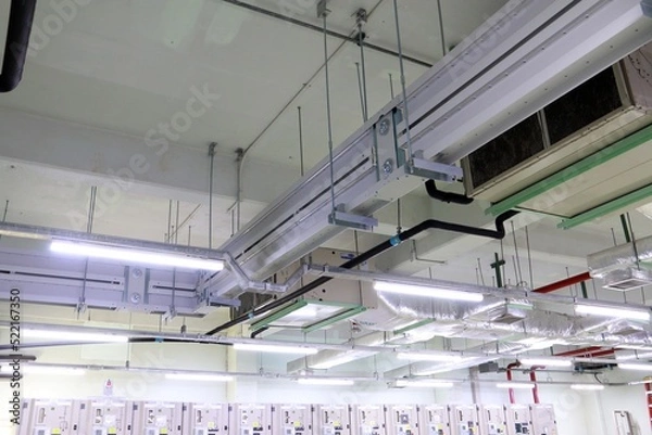 Obraz Conduit and clamp for cable electric ,Electrical Conduit with Clamp Installation on Roof ,Selective focus.	