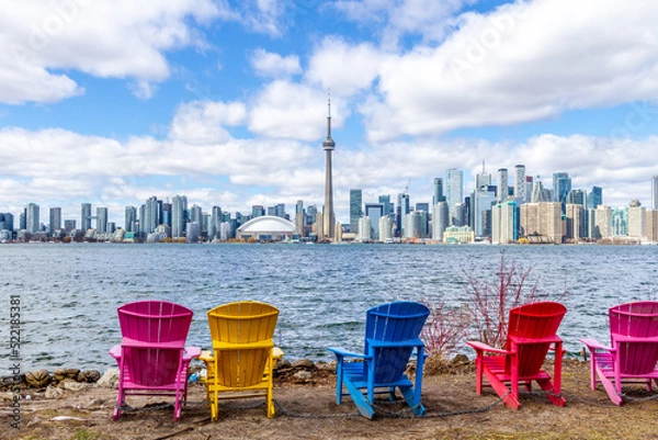 Fototapeta view of the city of Toronto from the island in front of toronto. This is a typical urban landscape during spring season
