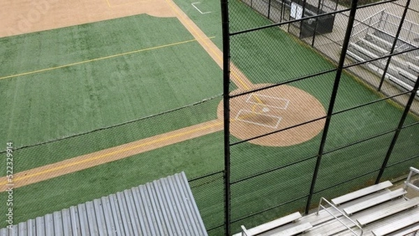 Fototapeta Angled view of a large, empty baseball field on an overcast day