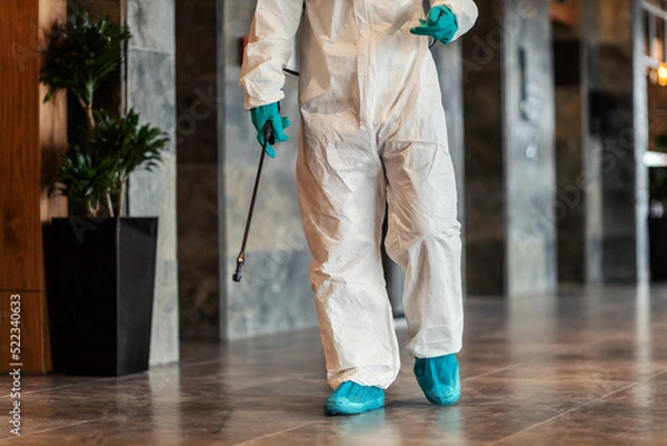 Obraz Close-up shot of an isolated sprayer for cleaning and disinfecting the coronavirus area in a hallway. Social distance, outbreak situation COVID19