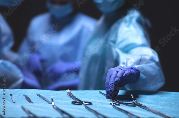 Fototapeta Team surgeon at work in operating