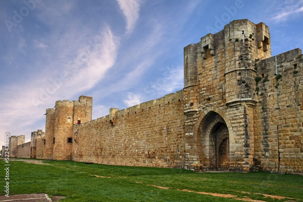 Obraz Aigues-Mortes, Gard, Occitania, France: landscape at dawn with the medieval city walls of the town of Camargue