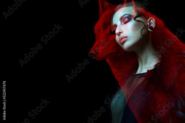Fototapeta Gothic girl and wolf double exposure on black background. Werewolf concept. space for text