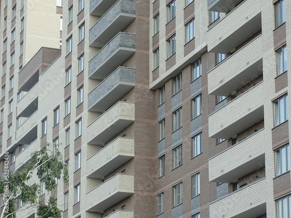 Obraz Full-color horizontal photo. Linear geometric composition. An inanimate landscape of parts of the facades of city buildings.