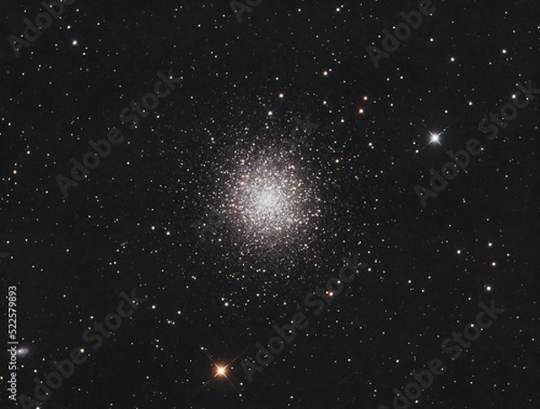 Fototapeta Messier 13 globular cluster in Hercules constellation, with many stars as background and a galaxy on the left.