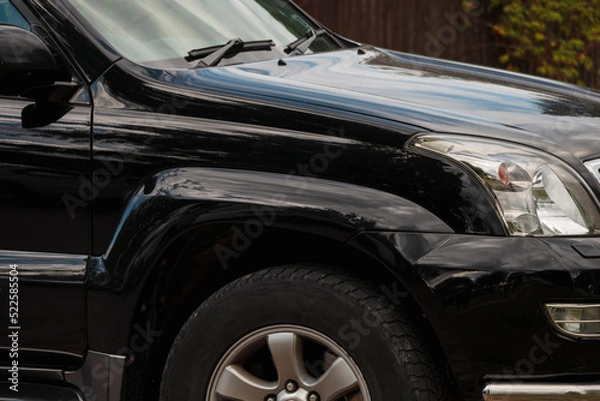 Fototapeta Side view of the front of the SUV. Elegant black car