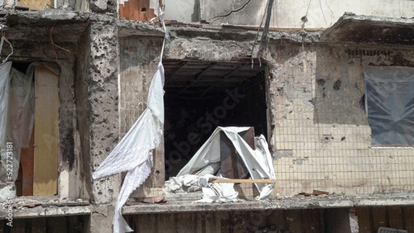 Fototapeta A destroyed residential building in Ukraine after the attack of the Russian army