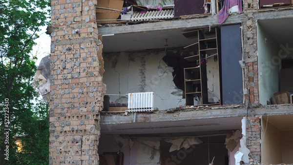 Fototapeta A destroyed residential building in Ukraine after the attack of the Russian army