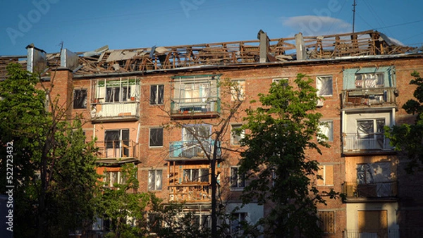 Fototapeta A destroyed residential building in Ukraine after the attack of the Russian army