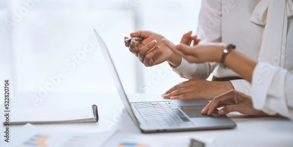 Fototapeta Female hands on laptop keyboard. Woman using laptop computer in office. Technology, business, distance studying, student lifestyle, meeting online, learning, internet marketing concept