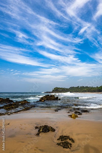 Fototapeta Rare clouds over the ocean lagoon