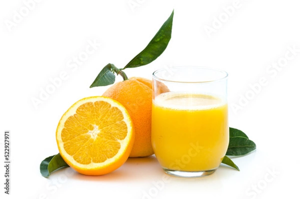 Fototapeta Oranges with fresh juice in a glass with leafs and stem on white background
