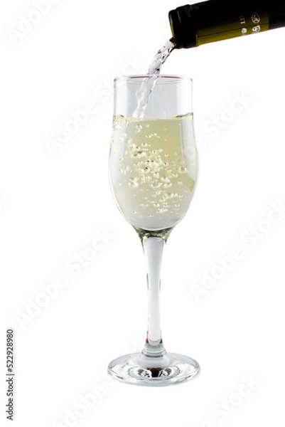 Fototapeta White sparkling champagne in a tall clear glass goblet on an isolated white background