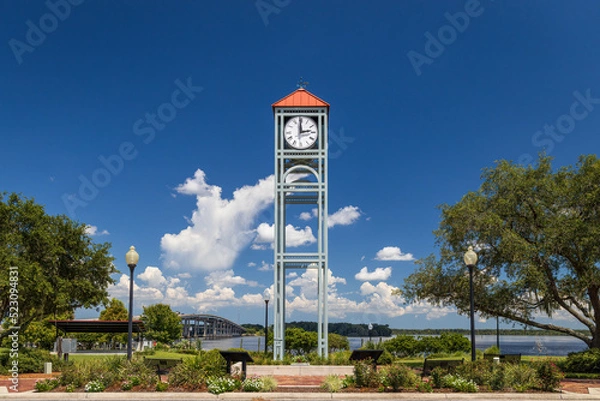 Fototapeta Photo of the clock tower at Riverfront Park in Palatka along the St John's River in Florida on a beautiful sunny day