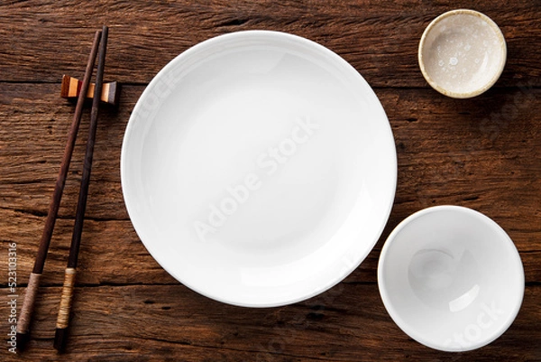 Fototapeta  ceramic set blank dish (plate) with bowl and chopsticks on dark table