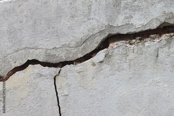 Fototapeta Cracked concrete wall texture, Cement background not painted in vintage style for graphic design or retro wallpaper
