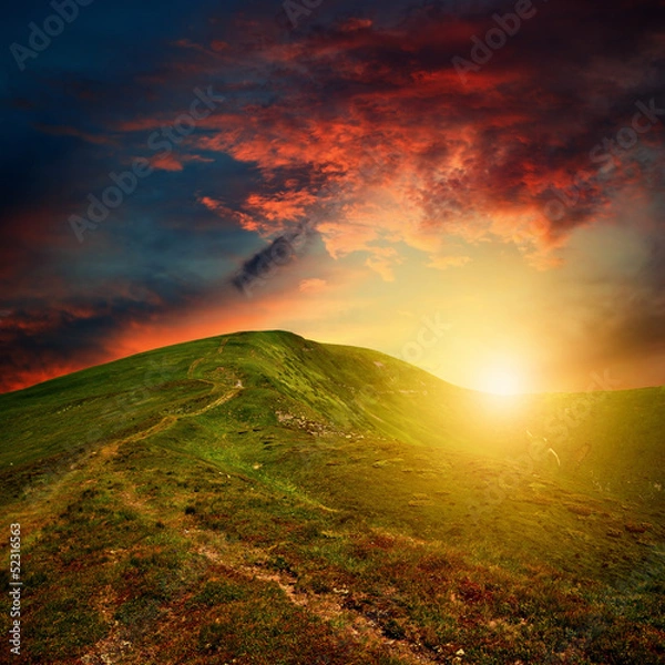 Fototapeta amazing mountain sunset with red clouds