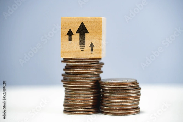 Fototapeta Capital growth concept. Increasing savings and capitalization. Stack of coins with up arrows.