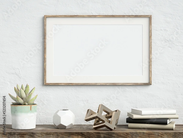 Fototapeta Mock up poster frame on white plaster wall with echeveria plant in a pot, books and geometric object on old wooden table; landscape orientation; stylish frame mock up; 3d rendering, 3d illustration