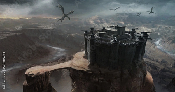 Fototapeta A castle fortress in a desert landscape surrounded by dragons flying in the sky.