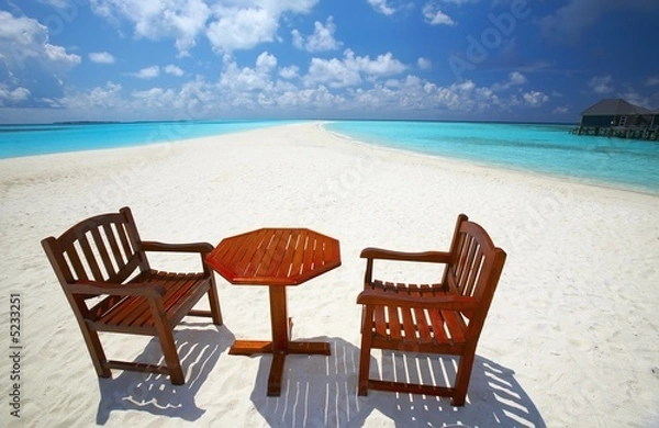 Fototapeta Chairs and  table are on the beach