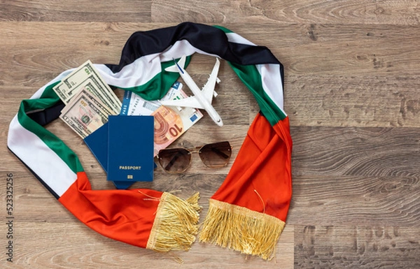 Obraz Plane over the flag of the United Arab Emirates United Arab Emirates travel concept. Toy plane on a flag scarf