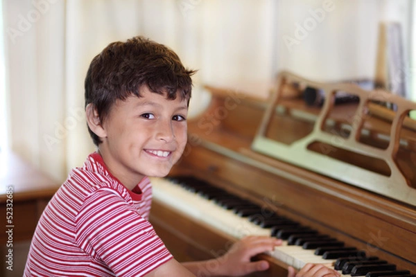 Obraz Young boy playing piano